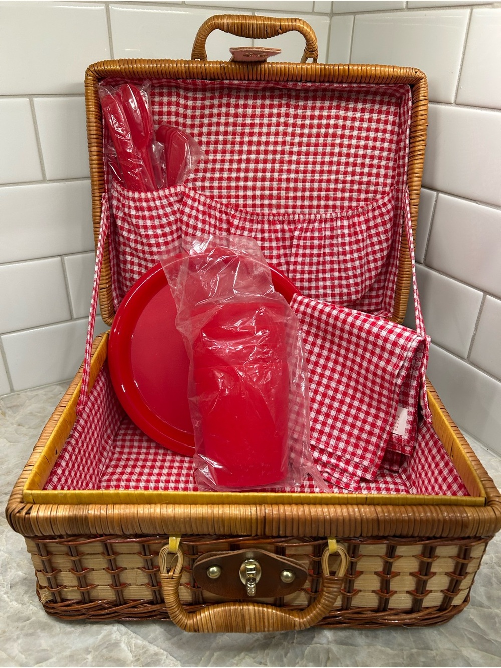Mini  picnic basket.  Four of each: plates, cups, forks, knives, spoons, napkins